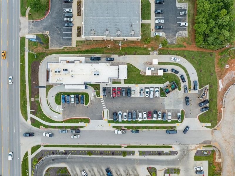 Aerial view of a completed commercial site with parking and drive-through built by Surfco